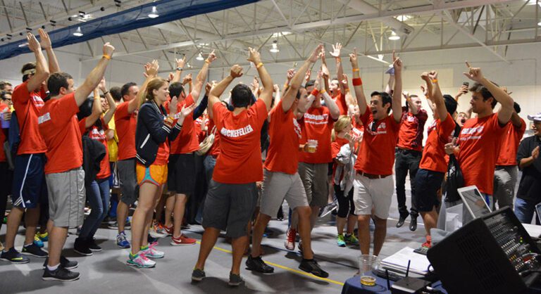 corporate team building activity - sports tournaments people celebrating a win