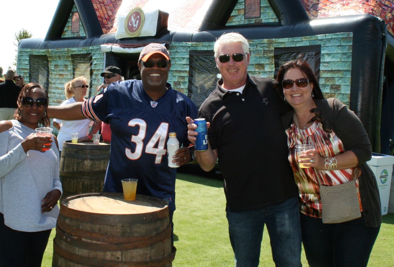 Employees enjoying craft beer and cocktails at a Company Fall Picnic