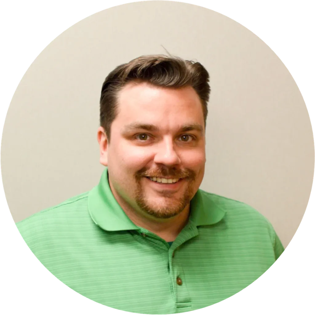 Person in green shirt, circular frame.